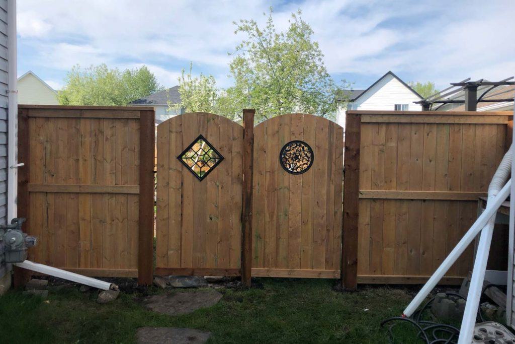 two wooden backyard gates
